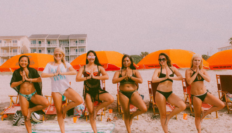 Group of women on beach for bachelorette party